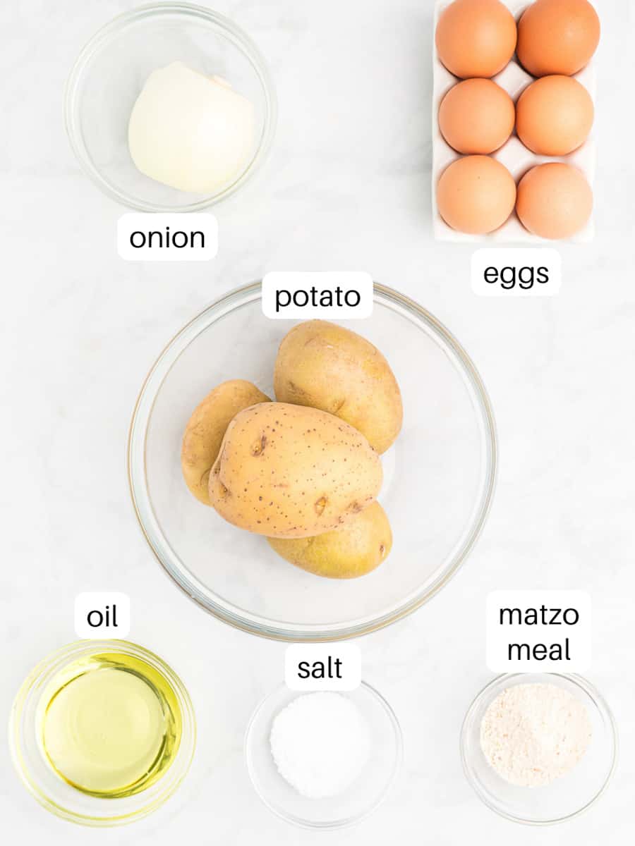 Ingredients for latke muffins in bowls including onions, eggs, potatoes, oil, salt, and matzo meal.