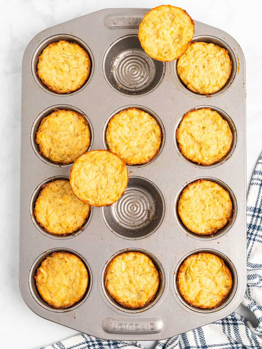 Muffin pan with potato latke muffins in it.