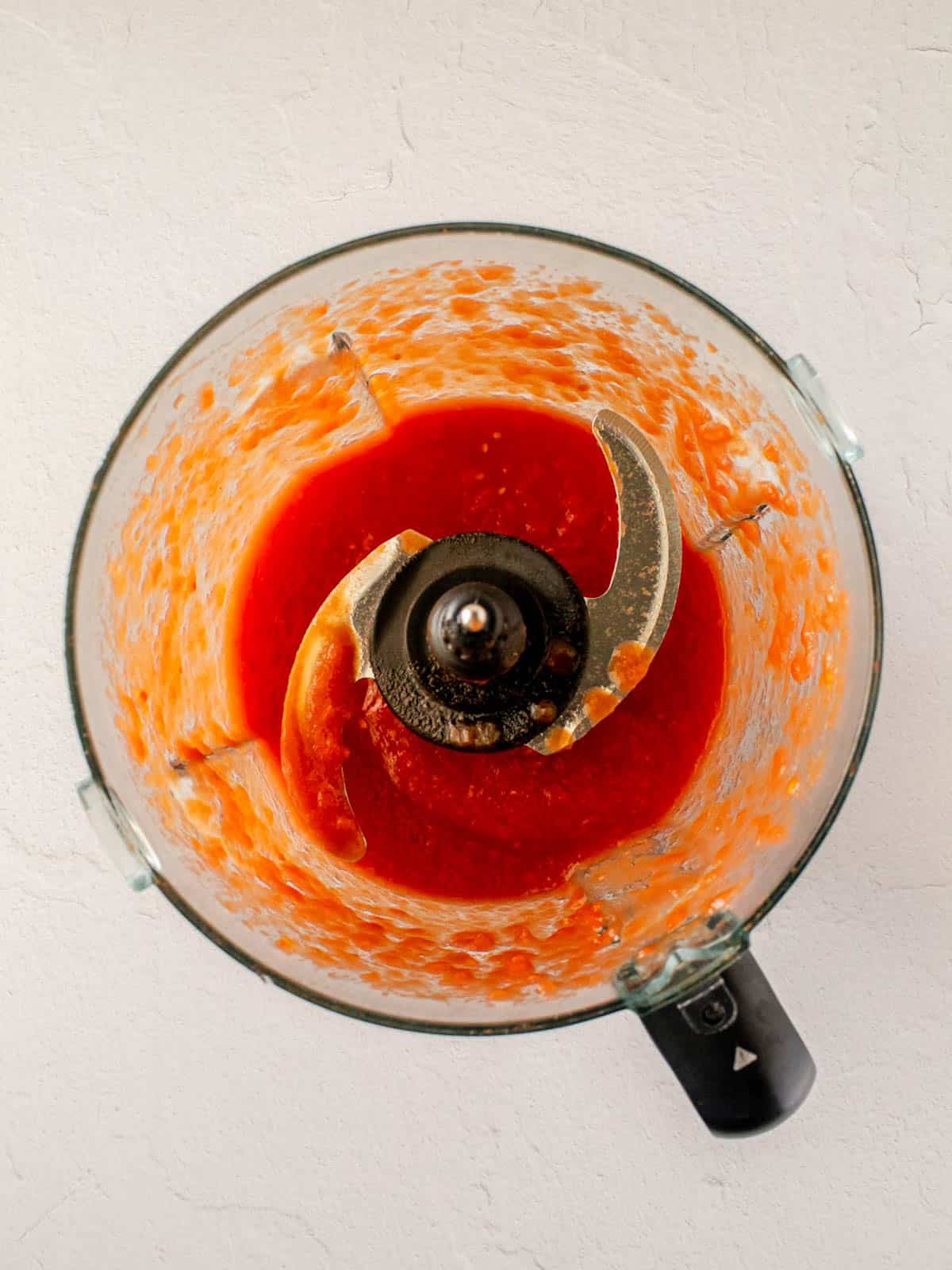 Canned tomatoes puréed in a food processor.