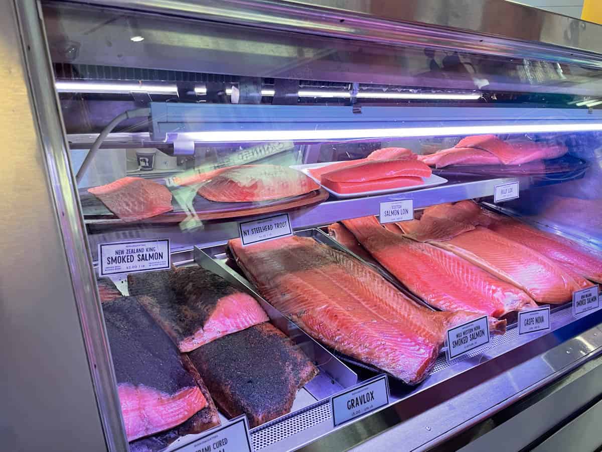 Different varieties of salmon in case at Russ & Daughters NYC.
