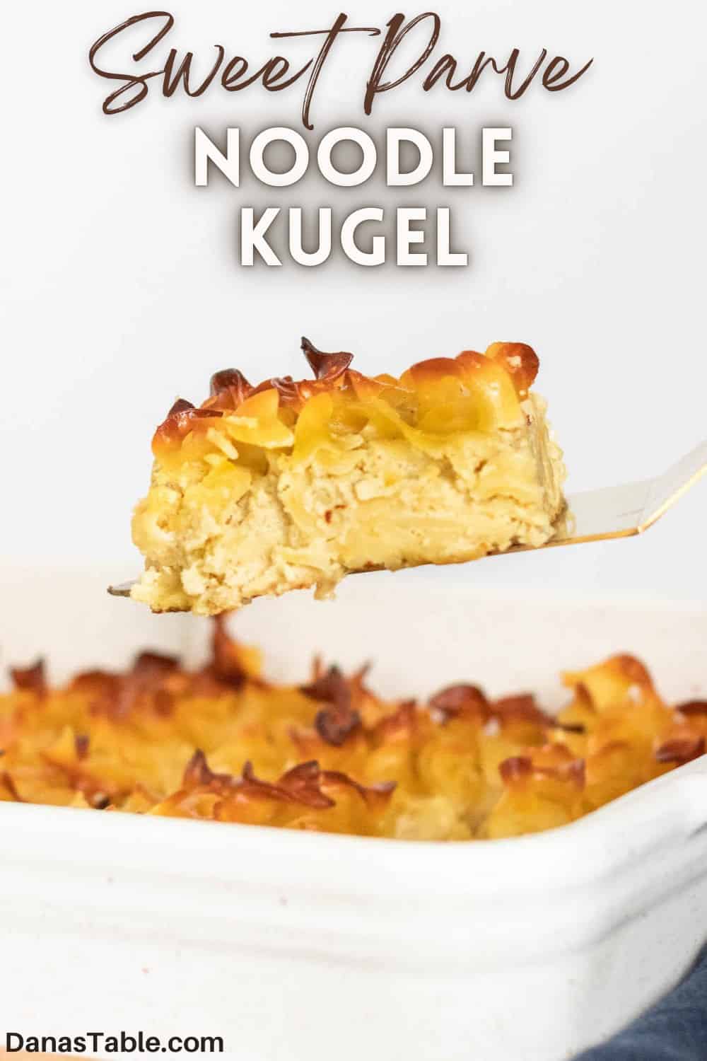Noodle kugel pin photo with a slice coming out of the pan.