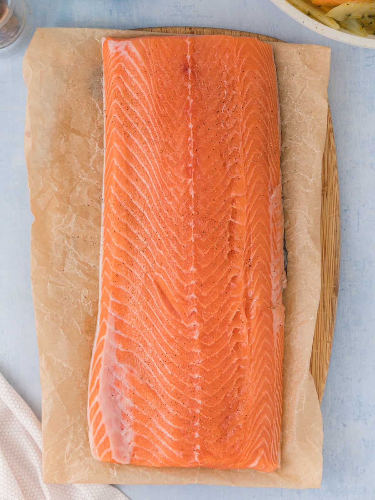 Whole salmon filet on butcher paper.
