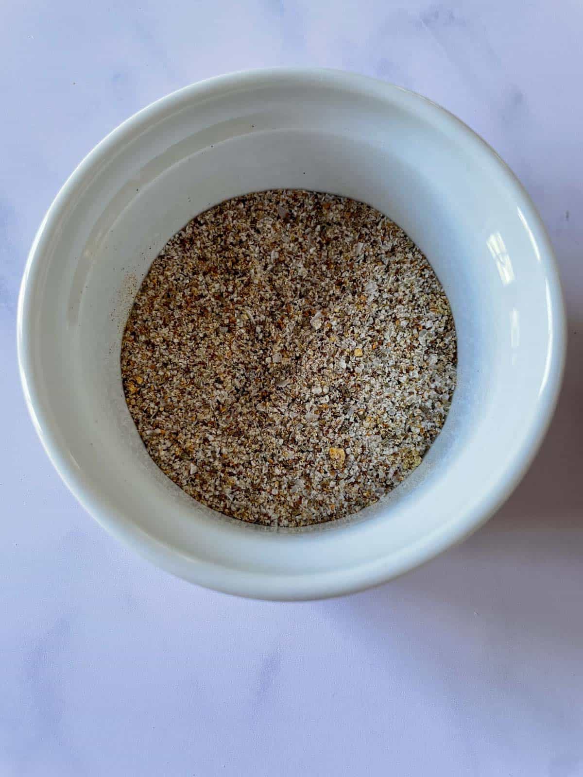 Spice rub for brisket in a small bowl.
