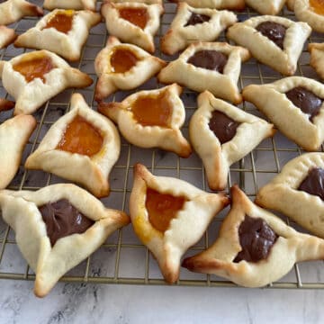 Hamantaschen cookies filled with nutella and apricot jam.