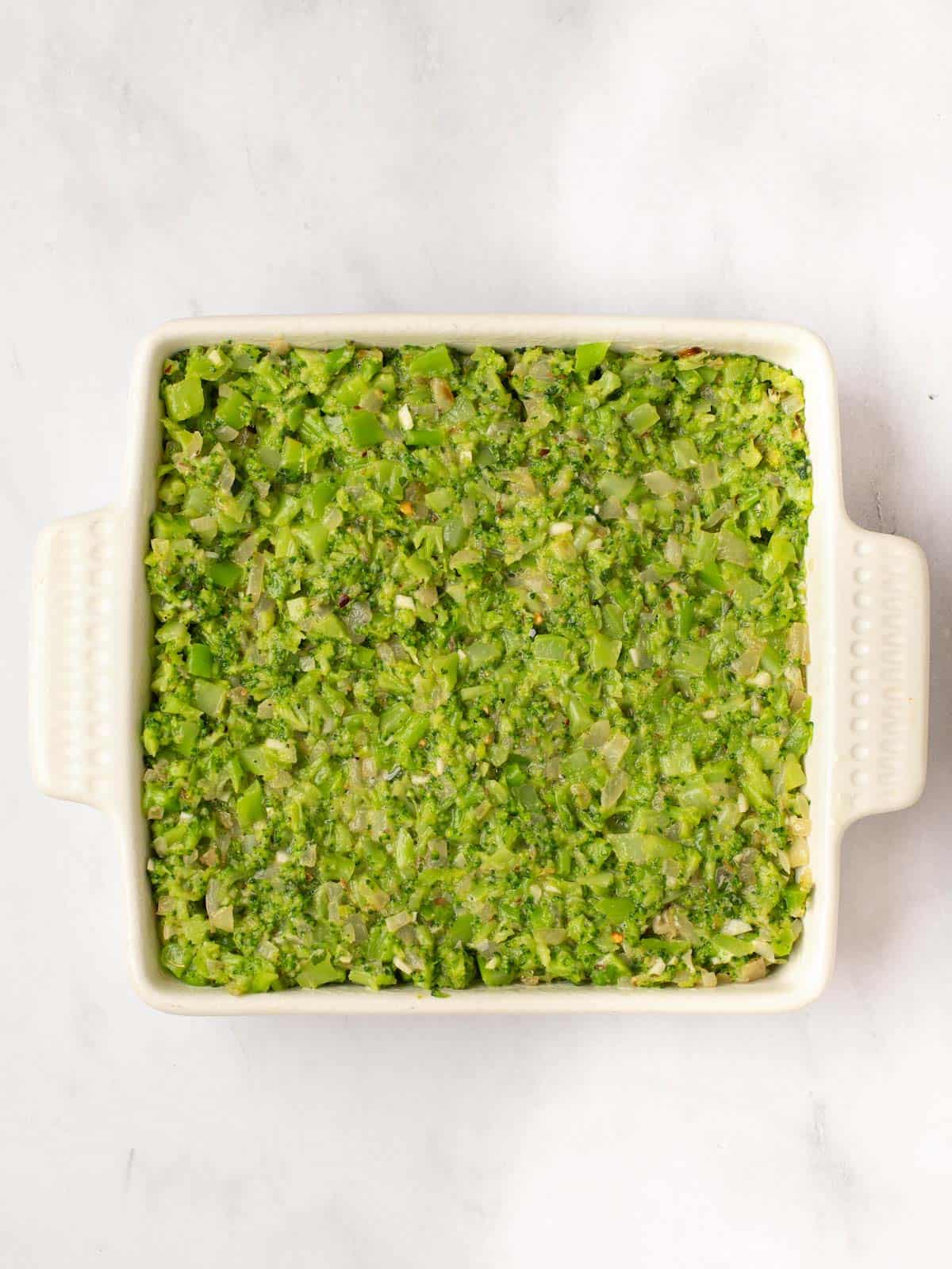 A dish of broccoli kugel before baking.