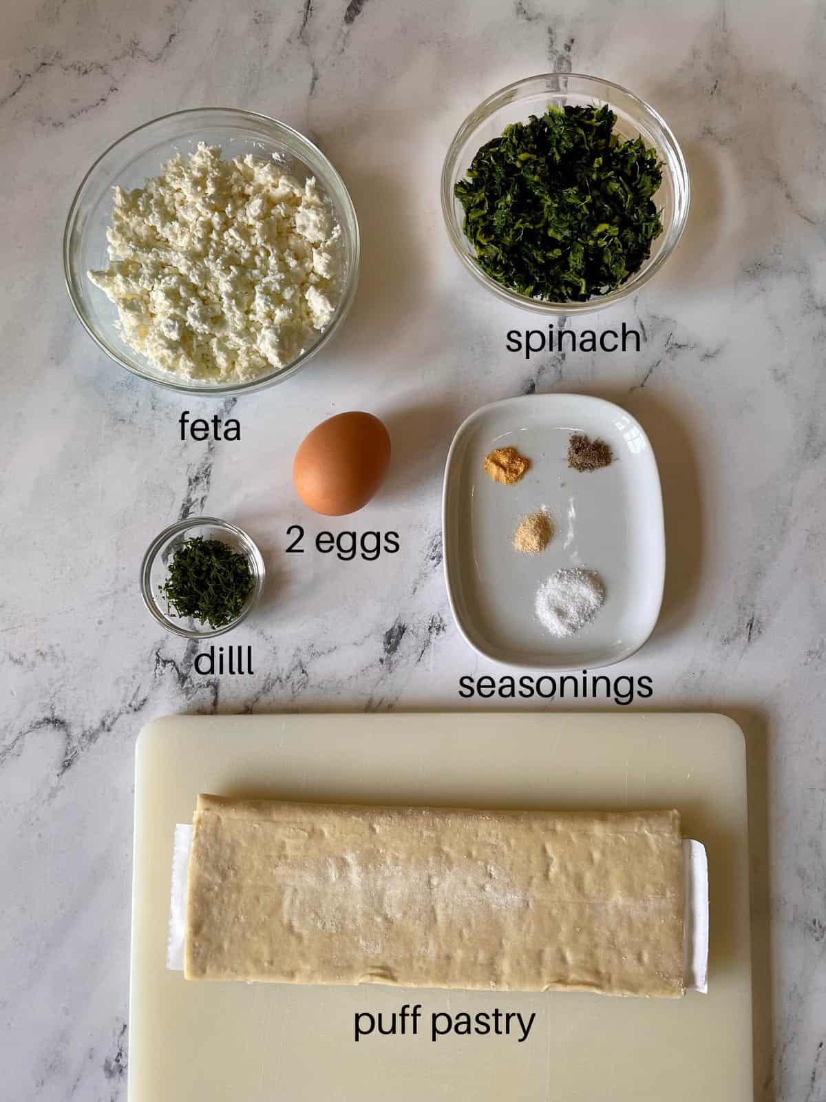 Ingredients needed to make spinach and feta bourekas.
