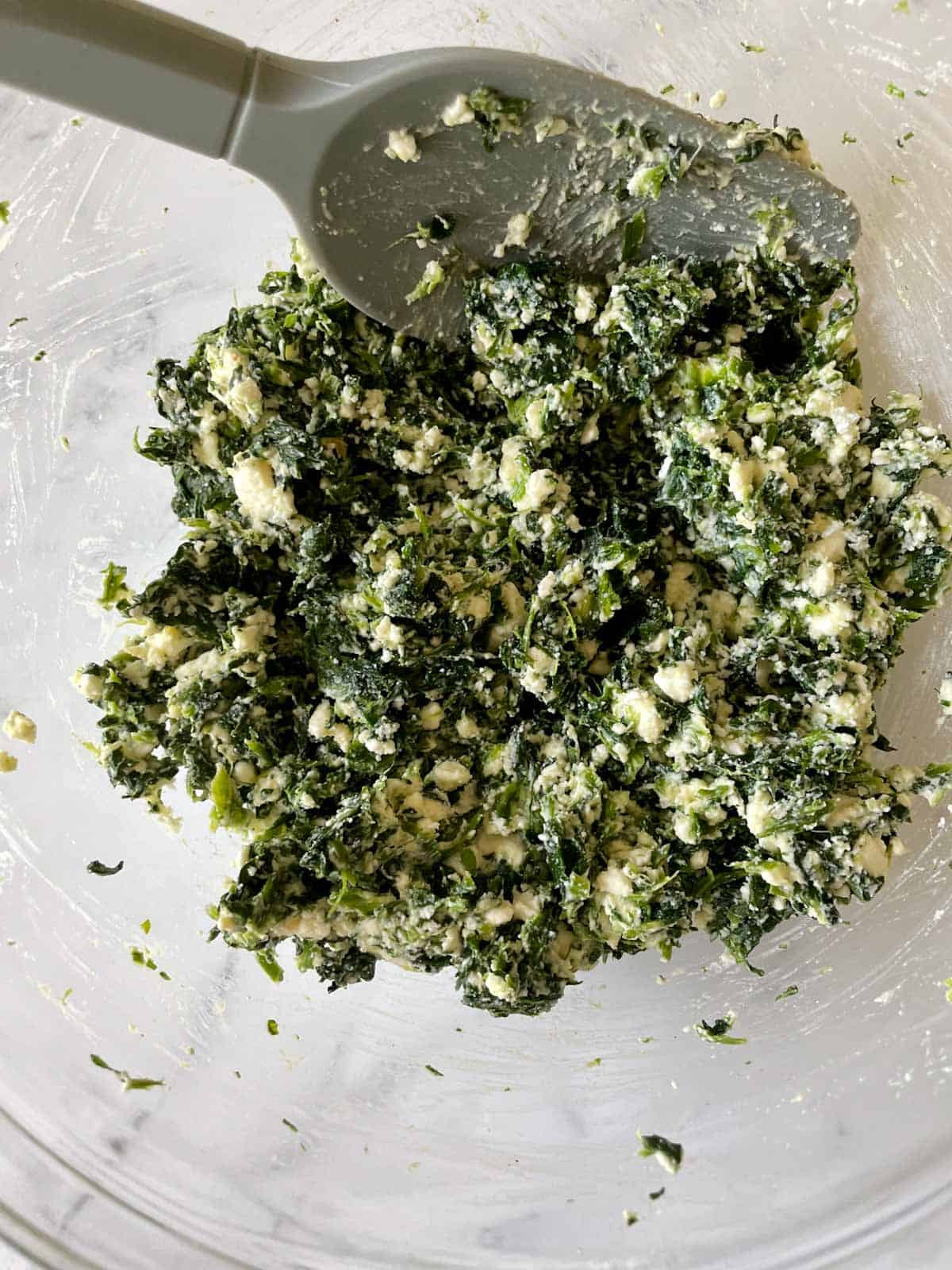 Spinach and feta filling for bourekas in a bowl.