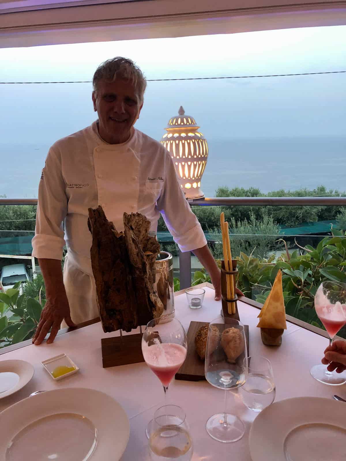 Chef owner Antonio Mullino standing at a table at his restaurant Quattro Passi.