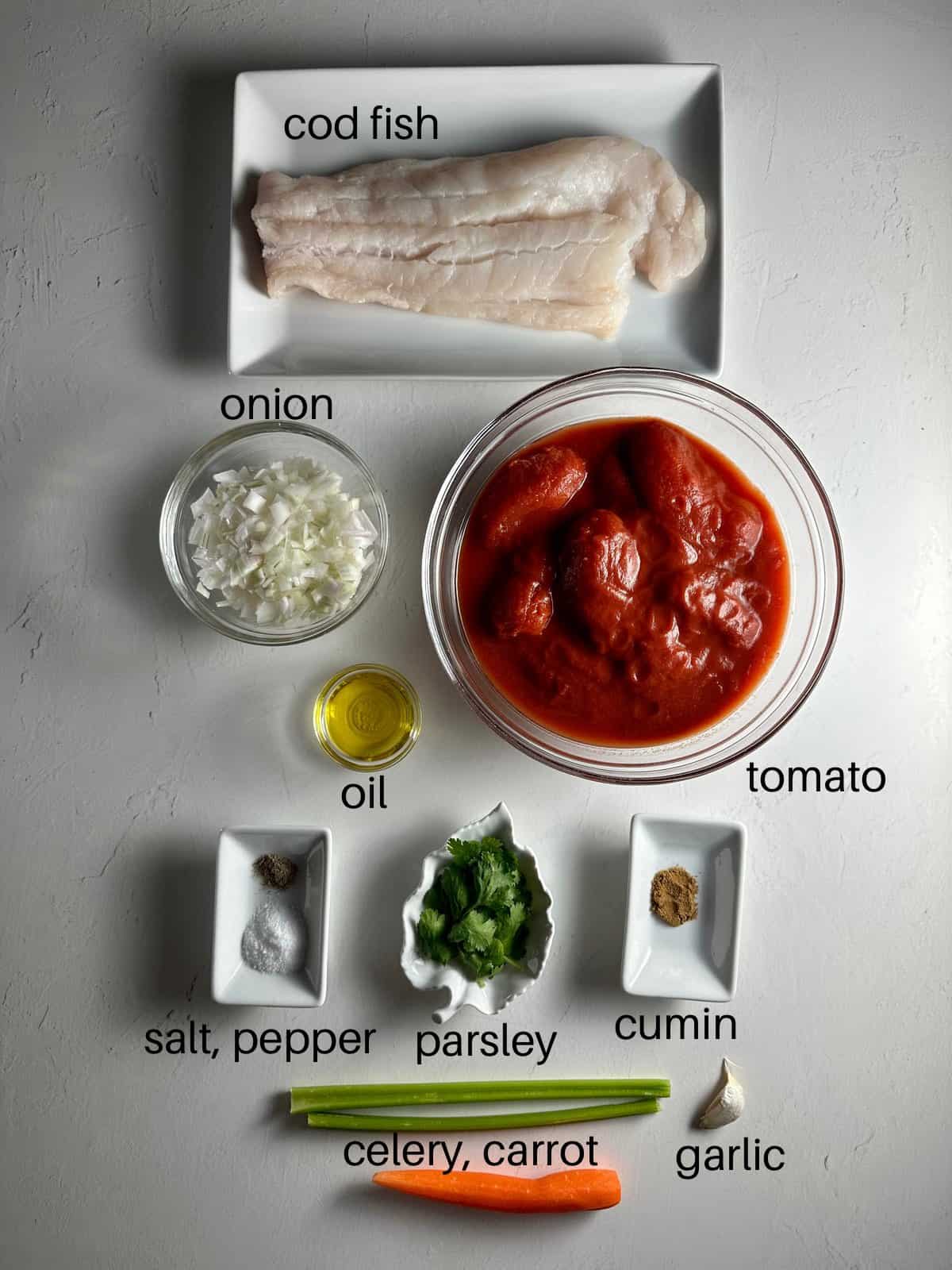 Ingredients needed to make Italian cod with tomato sauce.