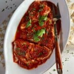 Baccalà cod with tomato sauce in a serving dish.