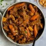Lamb tagine stew topped with parsley and almonds.