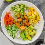 Deconstructed sushi salad with sweet potatoes, mango, carrots, cucumber, and edamame.