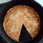 Skillet bread with a wedge taken out.