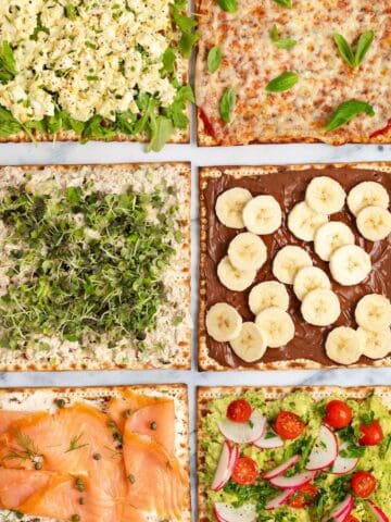 6 sheets of matzo with different toppings including avocado, egg salad, tuna salad, lox, pizza, and hazelnut spread.