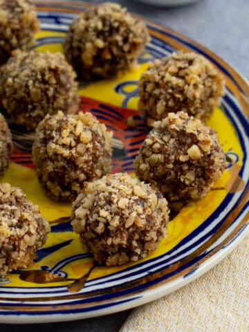Balls of Persian charoset on a serving plate.