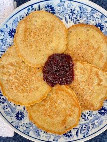 Matzo meal pancakes for passover on a plate with jam.