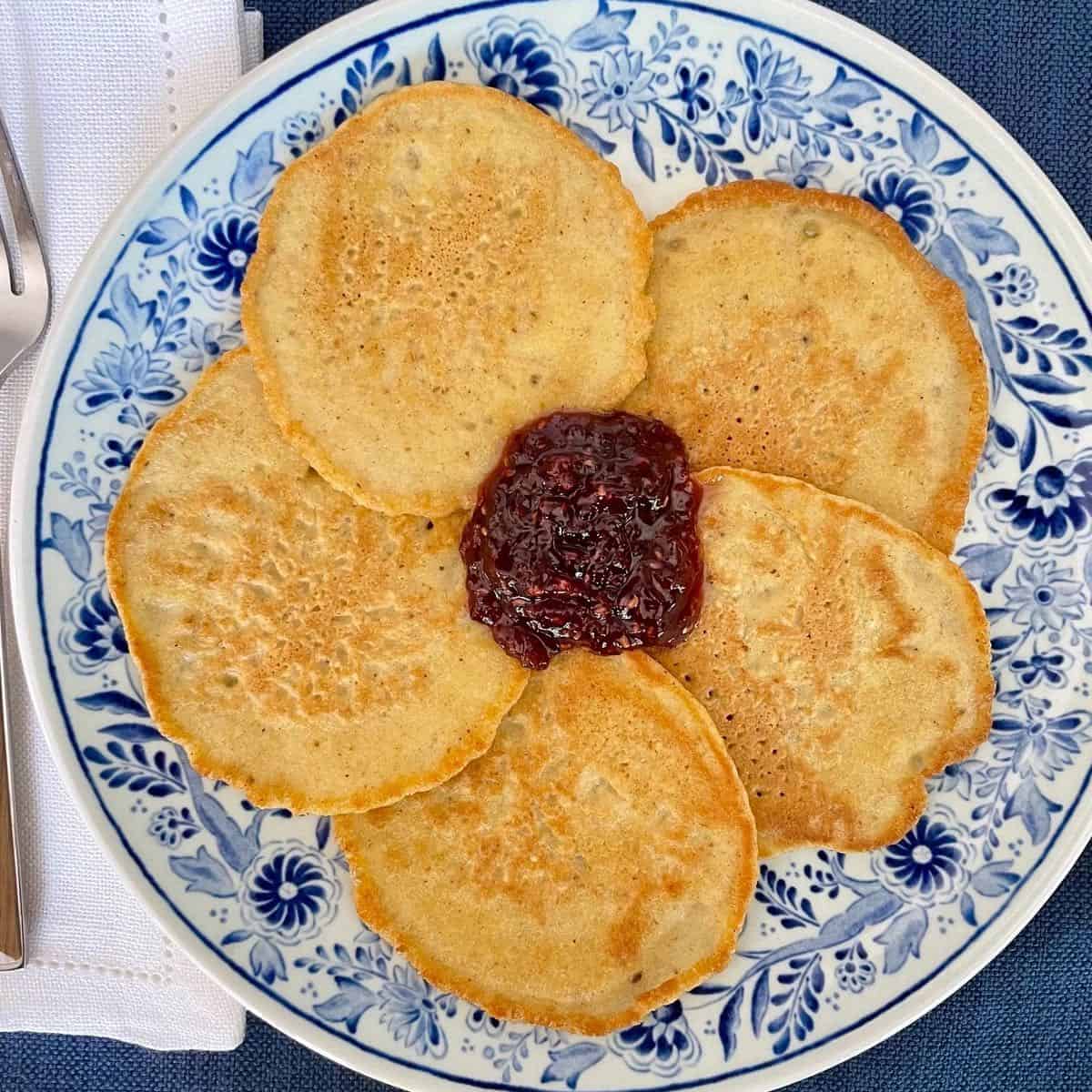 Matzo meal pancakes for passover on a plate with jam.