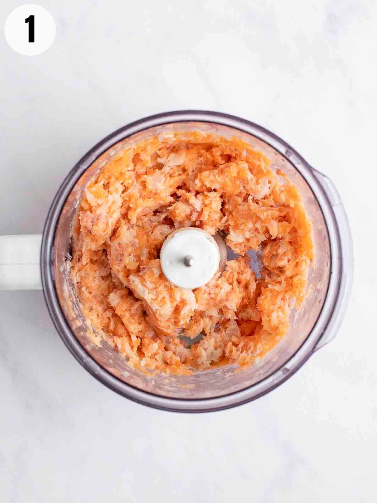 Grinding fish in a food processor.