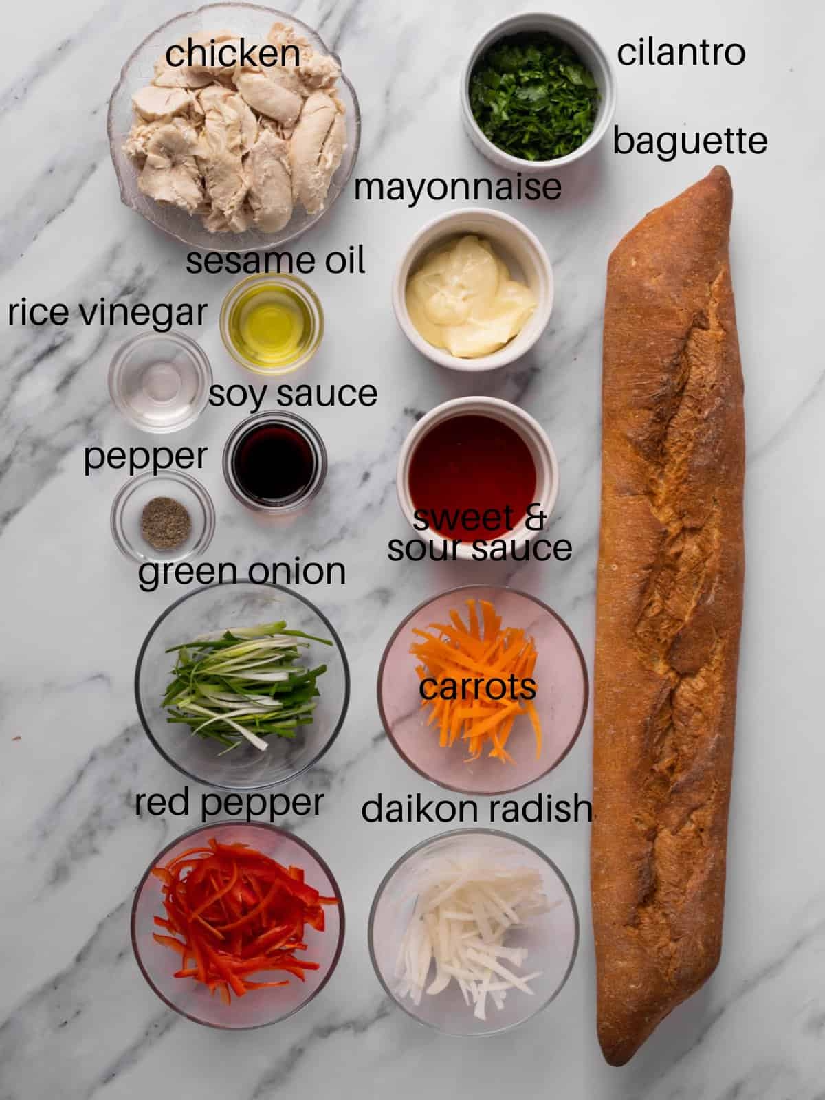 Ingredients for chicken banh mi sandwich in bowls.