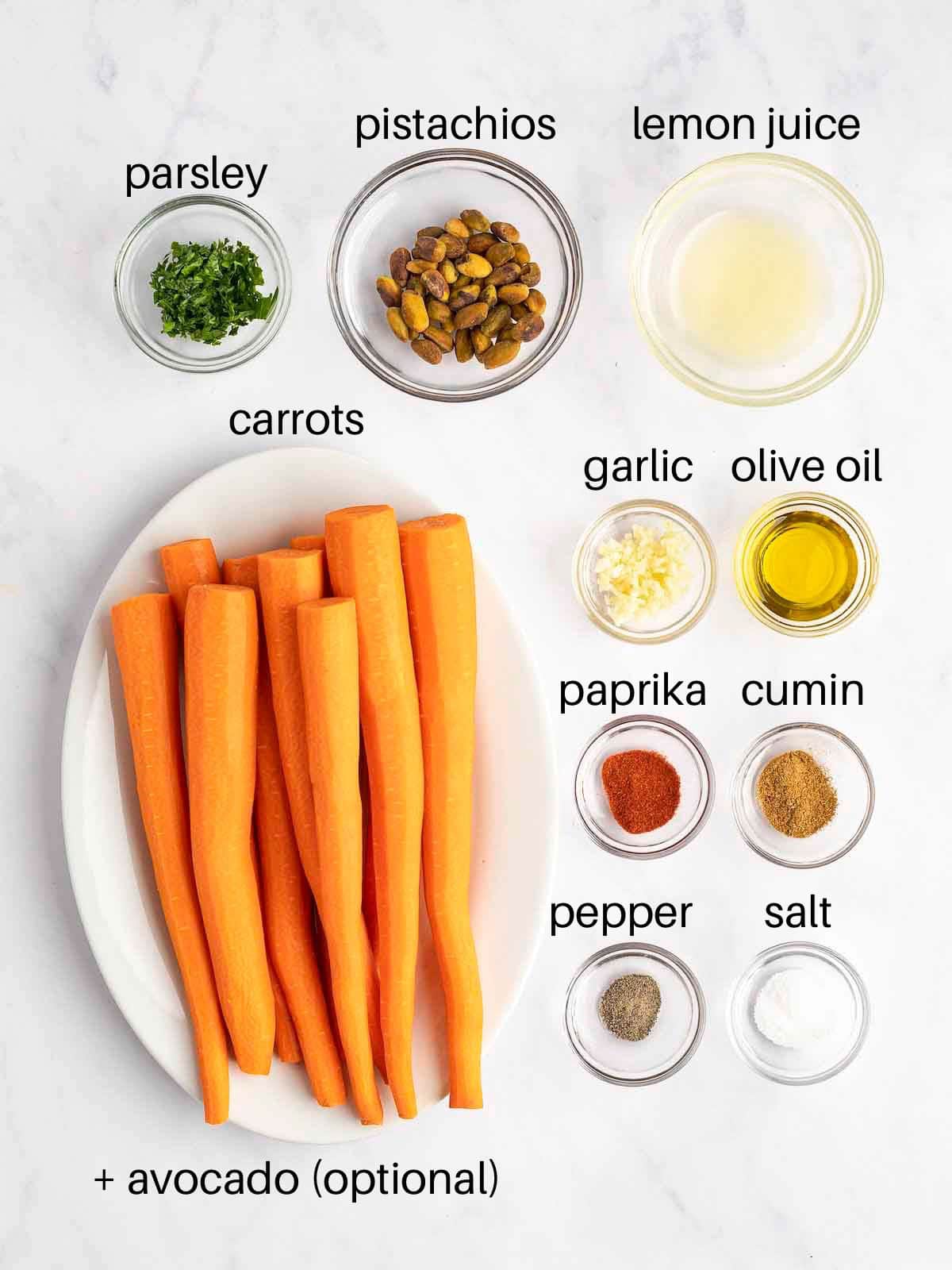 Ingredients to make Moroccan Carrot Salad in separate glass bowls ready for preparing.