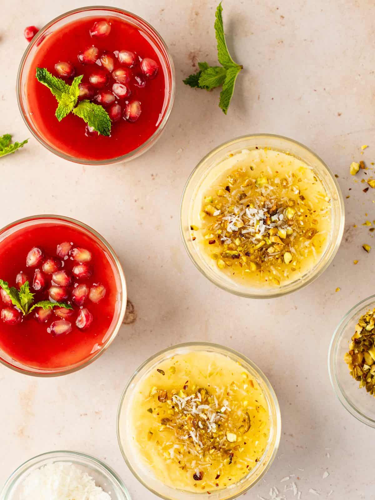 Malabi pudding bowls with topping variations in raspberry and peach. 