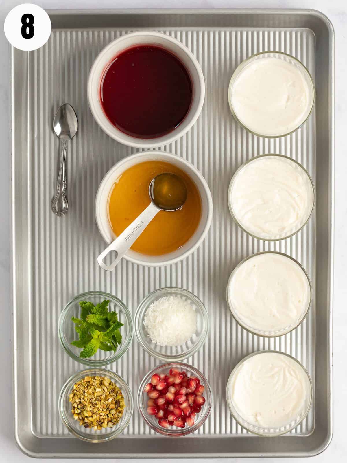 Bowls of pudding, bowls of syrup and bowls of toppings. 