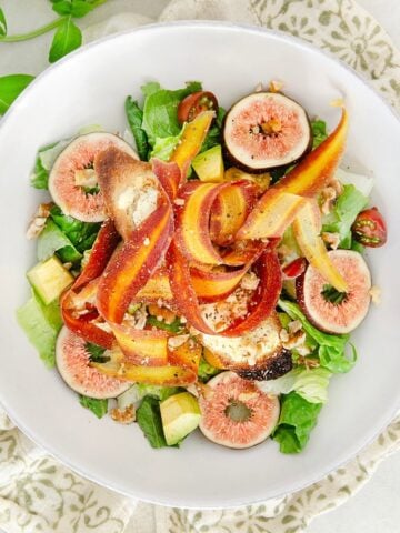Summer salad with goat cheese crouton and figs.
