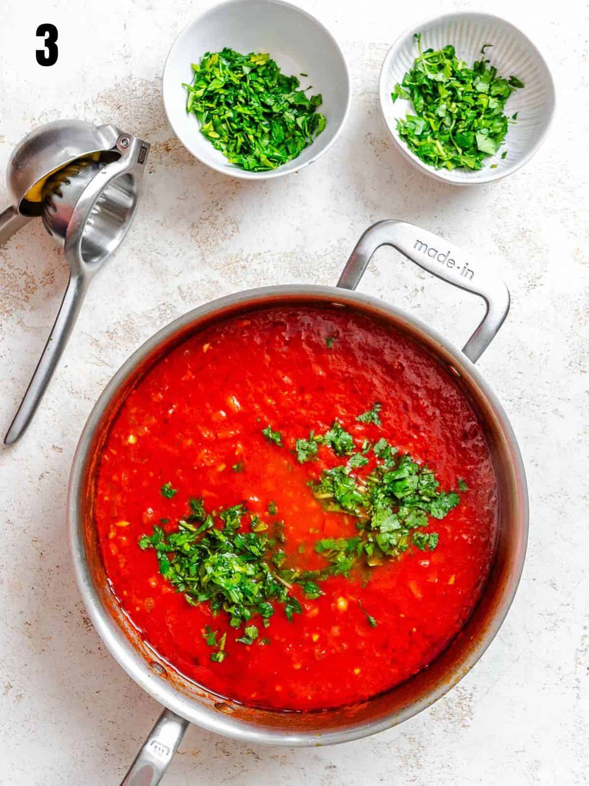 Adding spices and seasonings to the pot with the tomatoes.