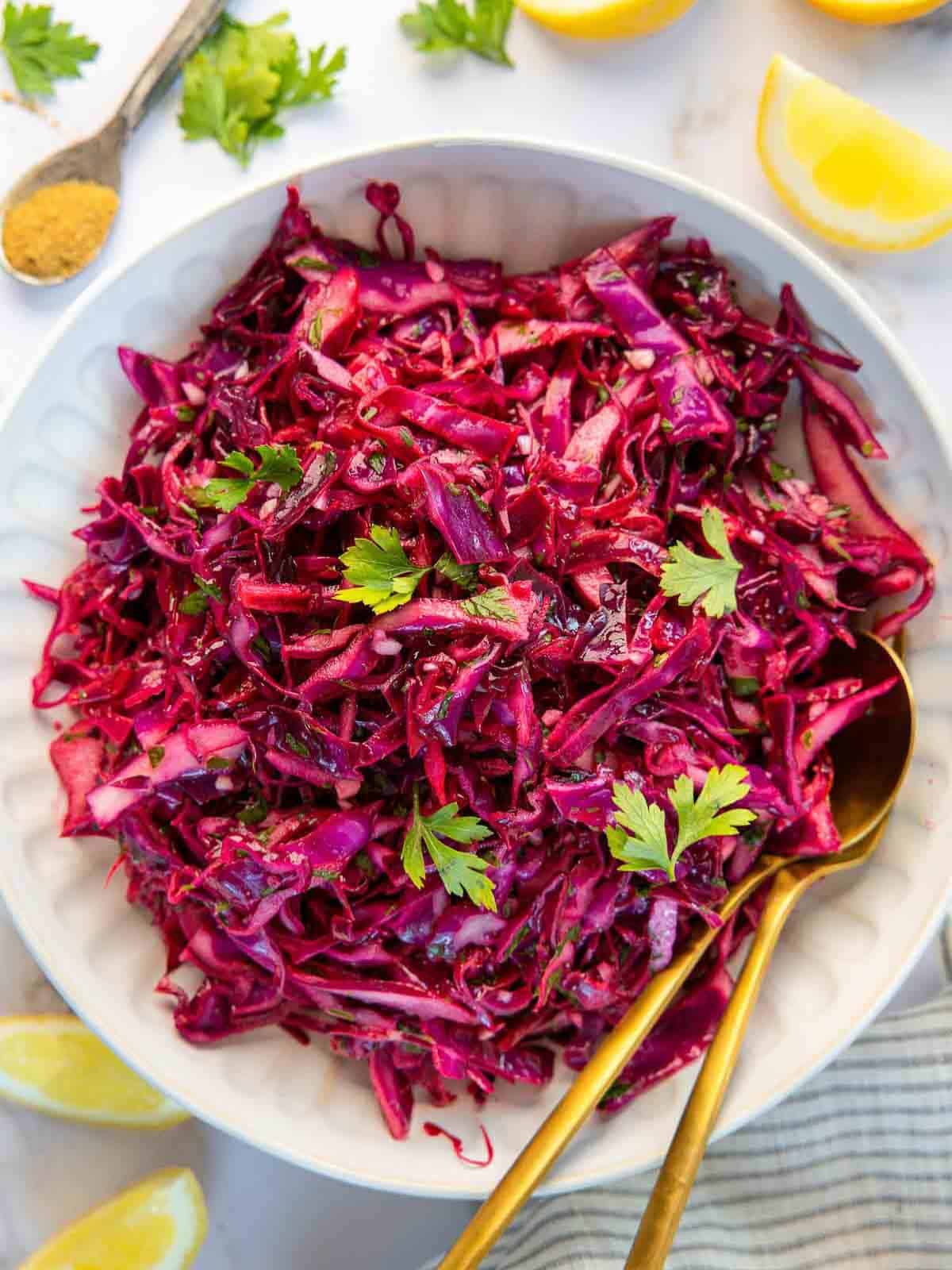 Red cabbage salad on a white plate. 