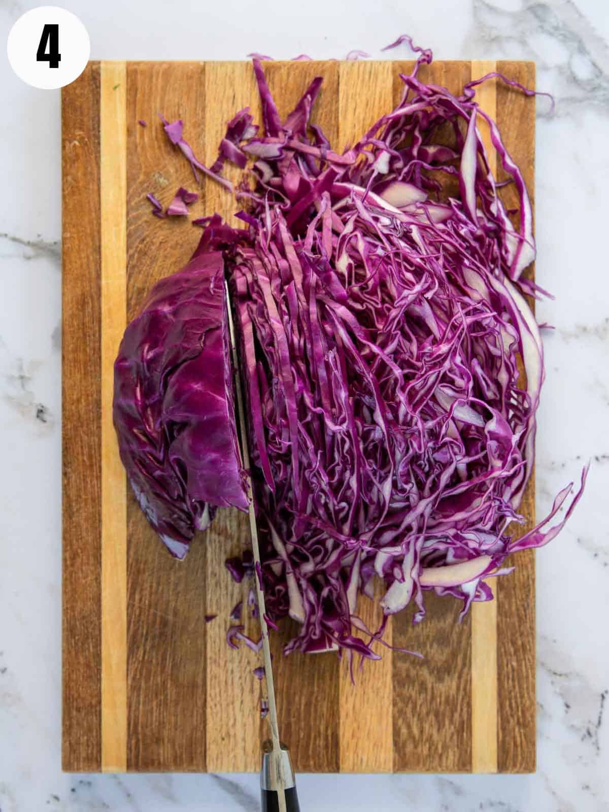 Finely slicing a red cabbage.