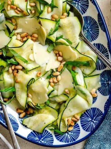 Zucchini ribbon salad with shaved Parmesan and pine nuts.