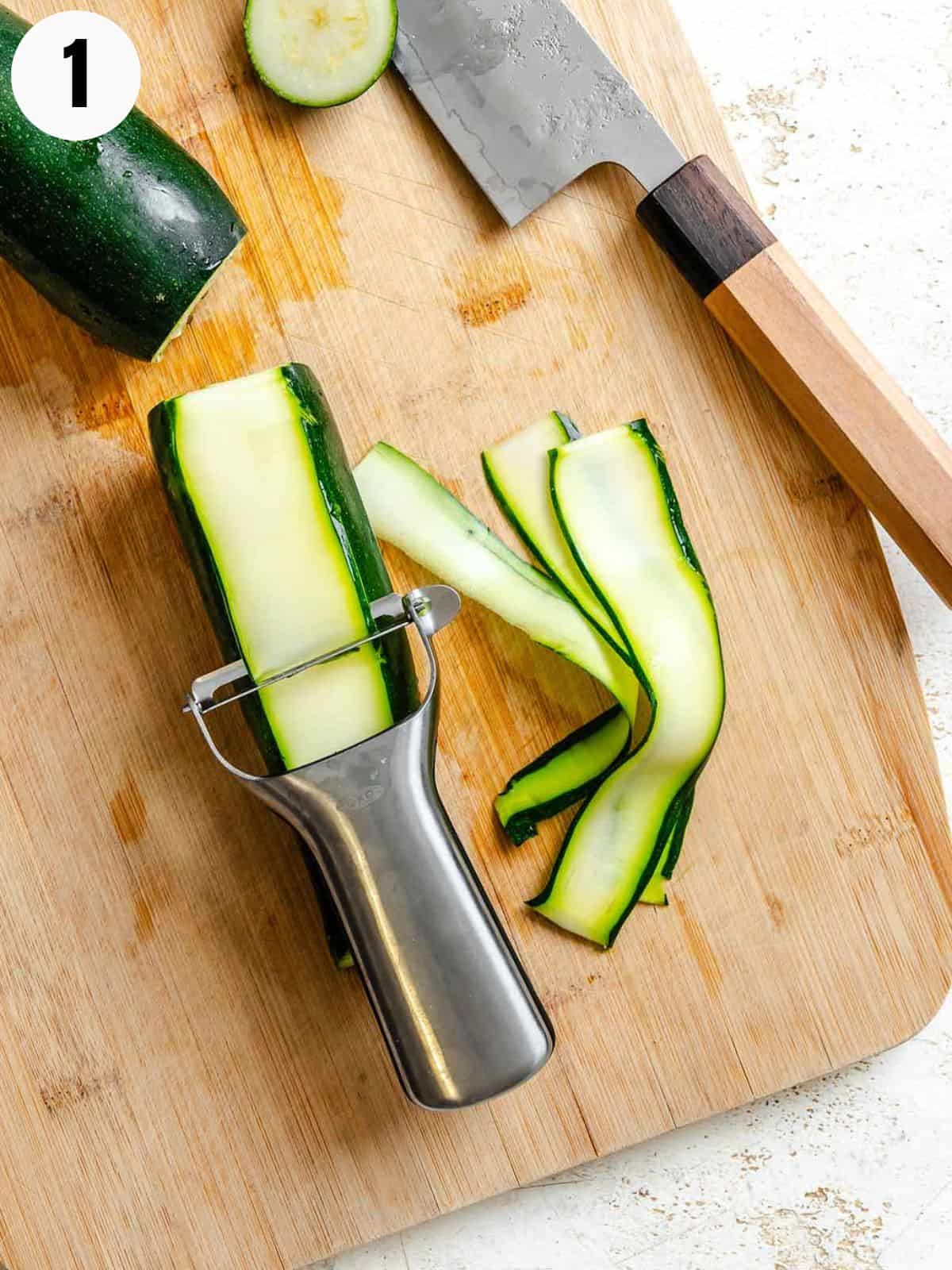 How to cut zucchini ribbons with a vegetable peeler.