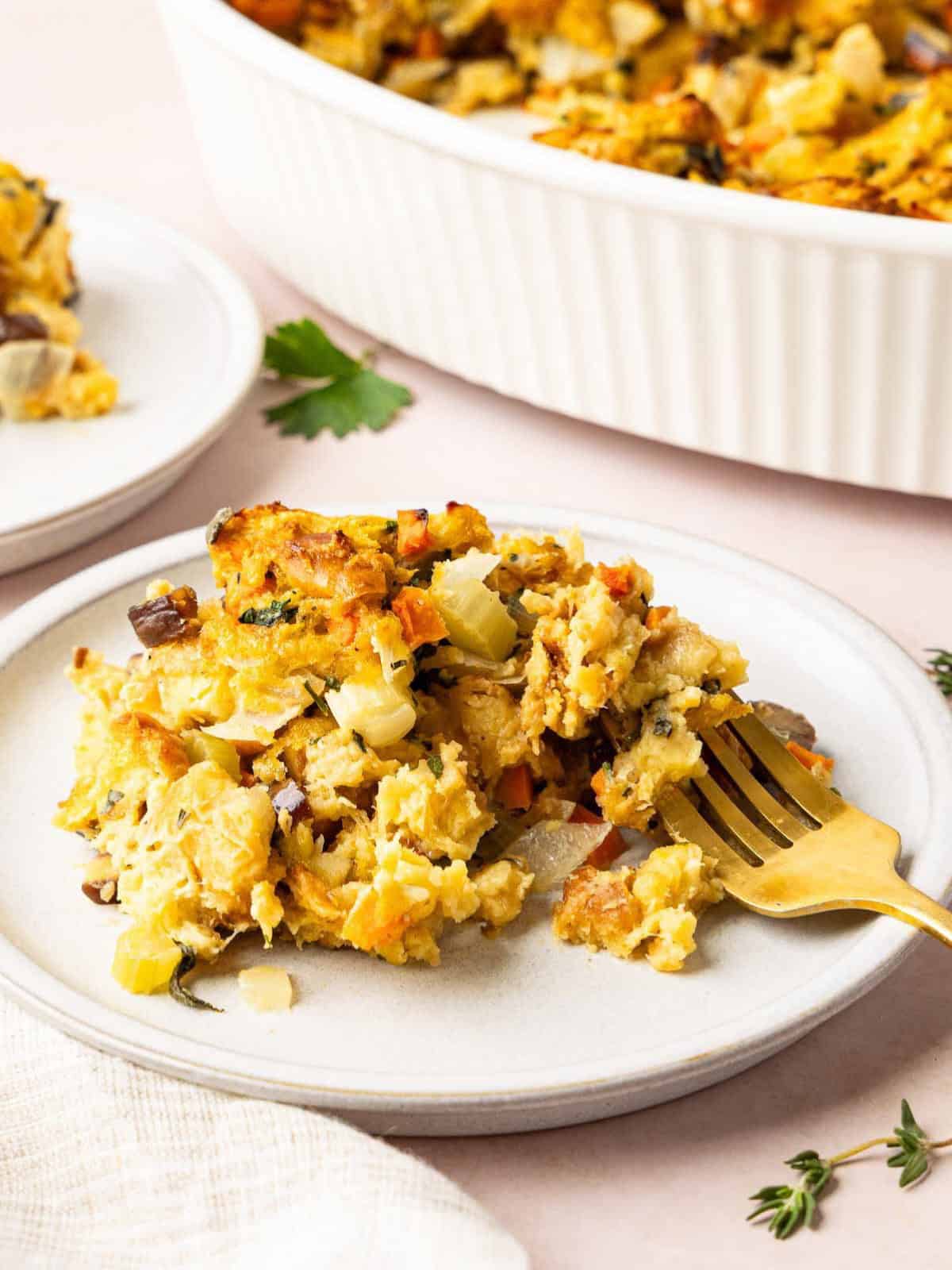 Challah stuffing on a plate with a fork.