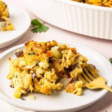 Challah stuffing on a plate with a fork.