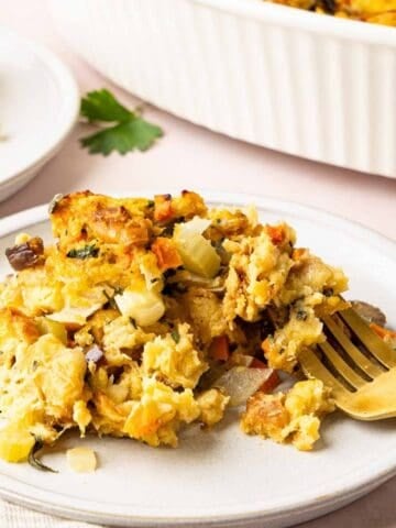 Challah stuffing on a plate with a fork.