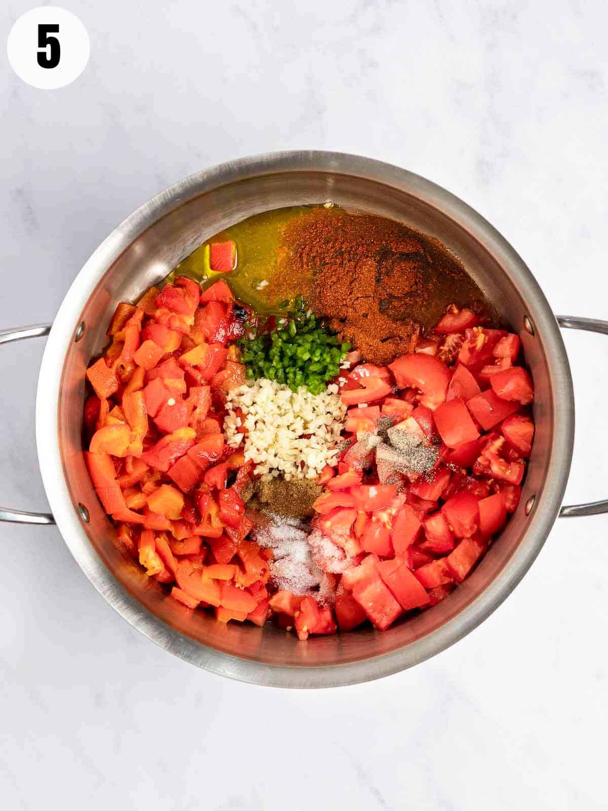 All the matbucha ingredients in a bowl.