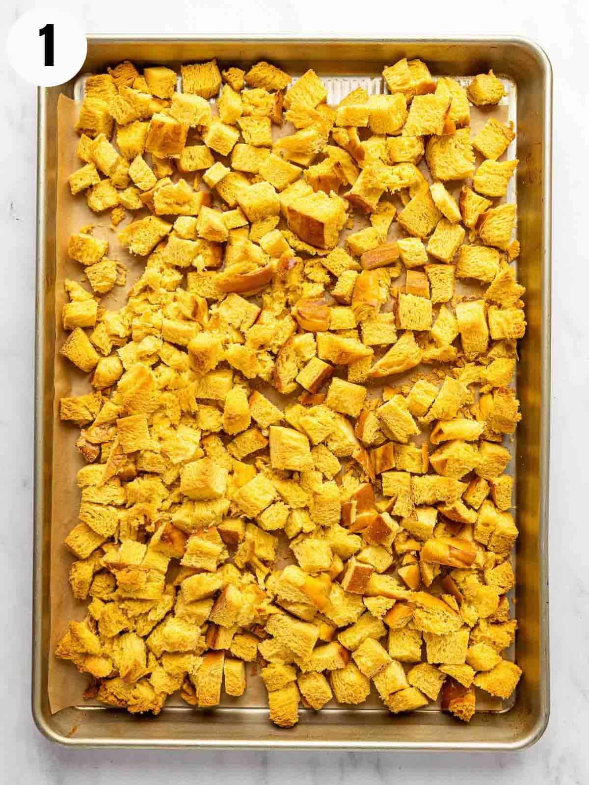 Challah cubes on a cookie sheet.