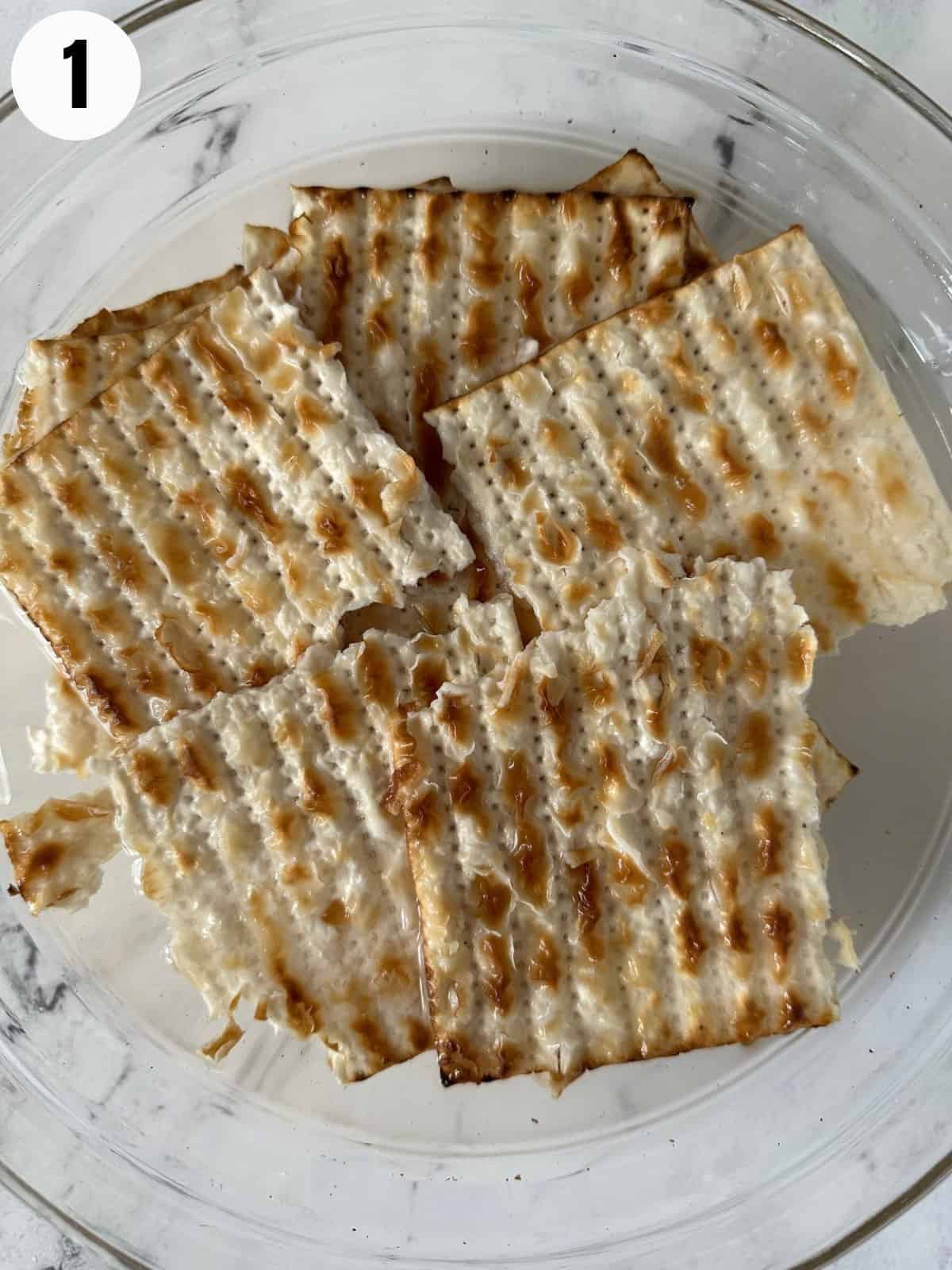 Soaking matzo pieces for matzo brei.