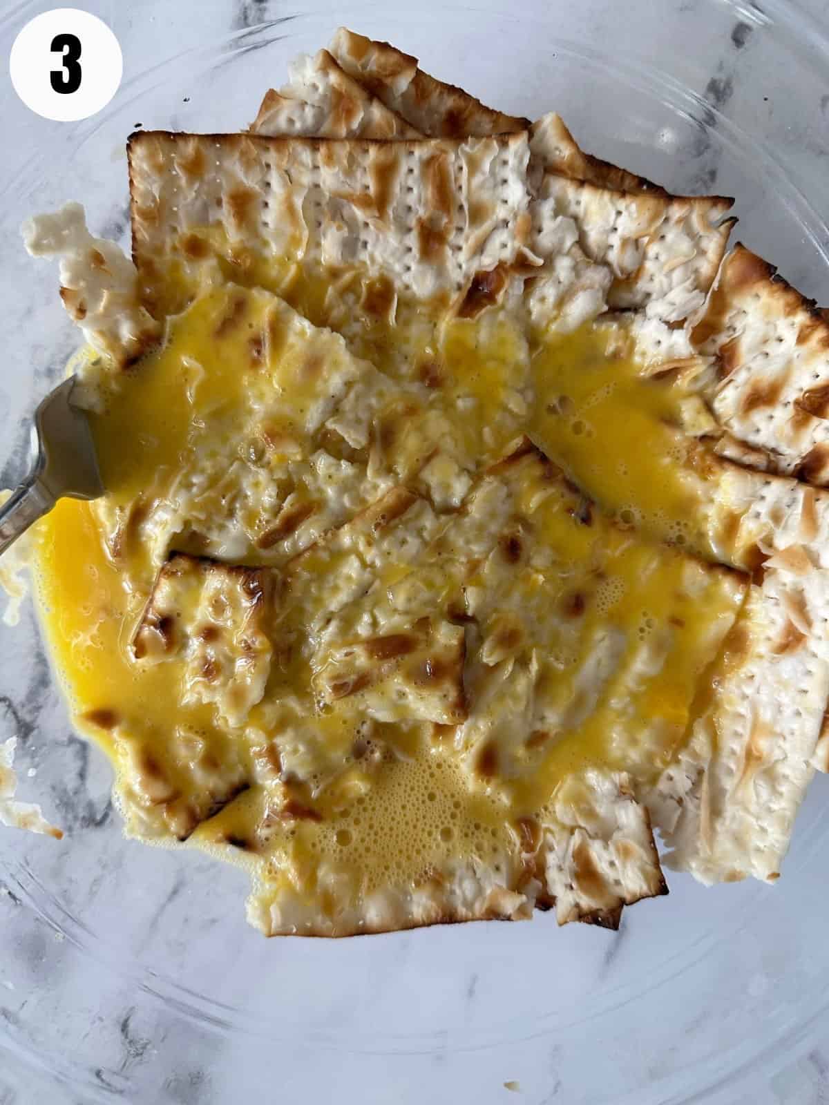 Add egg to matzo to make matzo brei.